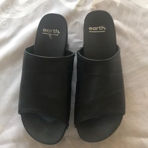 Black leather clogs by Earth
